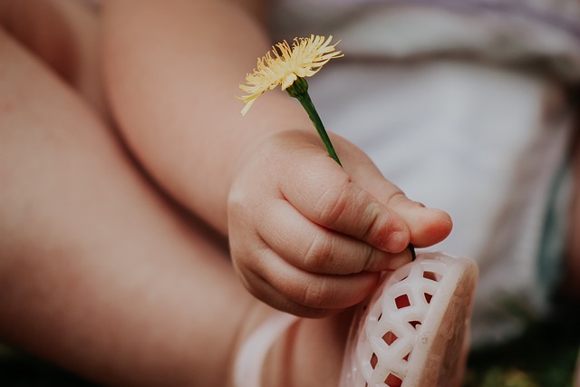 child with flower in her shoe