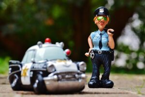 toy police car and police officer